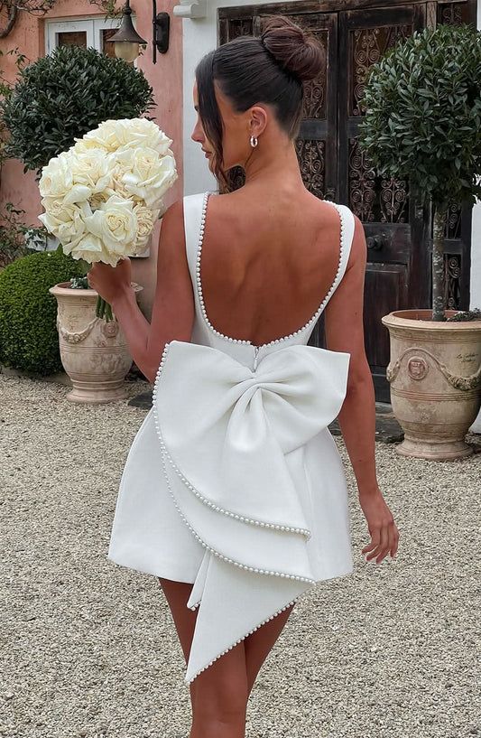 White A-line mini dress with bow back and pearl-trim scalloped straps