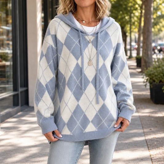 Front view of blue and cream argyle hooded sweater with a relaxed fit and ribbed trim.