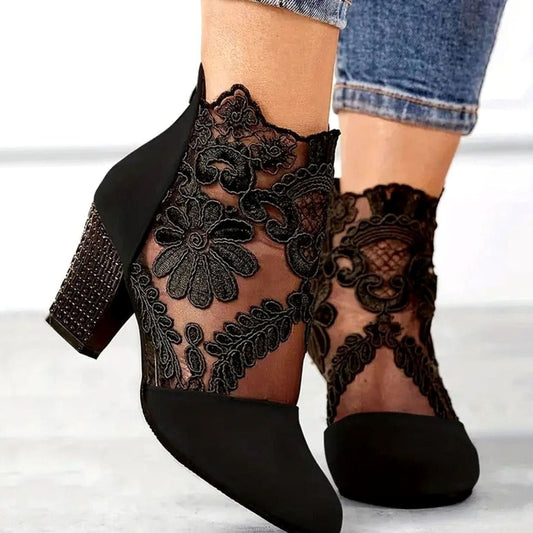 Black suede ankle booties with sheer floral lace panels and block heel