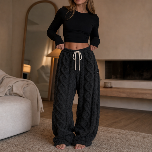 Charcoal cable-knit lounge pants with a white drawstring waist and relaxed straight legs