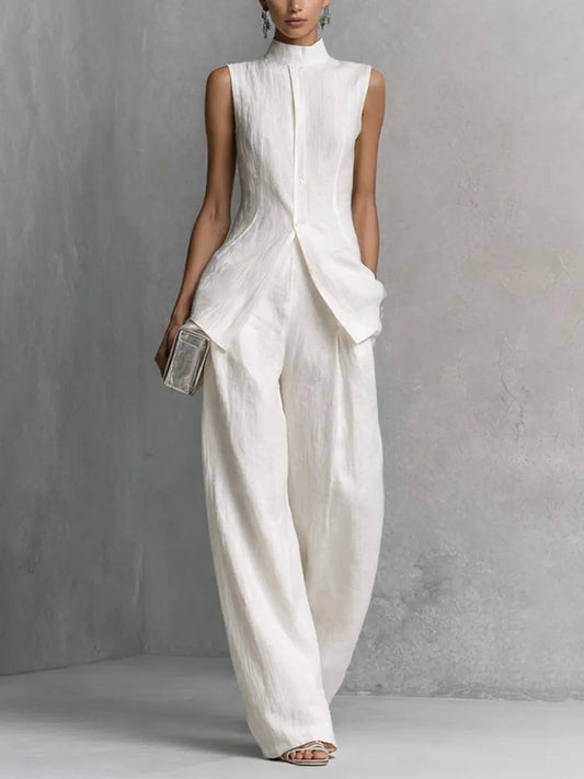 White sleeveless cotton-linen top with wide-leg pants, shell-button front detail