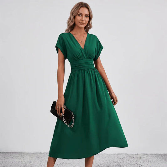 Green V-neck midi dress with ruched waist and short sleeves, flared skirt