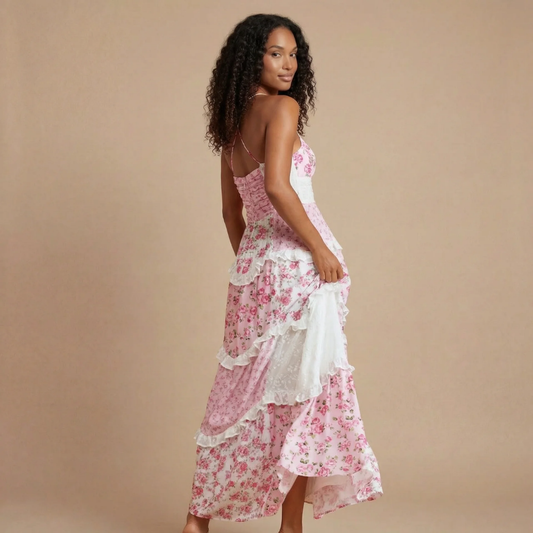 Pink floral V-neck maxi dress with tiered ruffle skirt and lace trim, side view