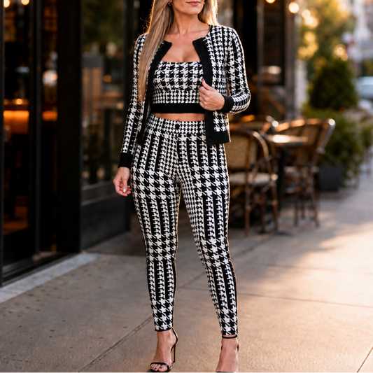 Black houndstooth three-piece sweater set with cardigan, tank top, and slim pants.