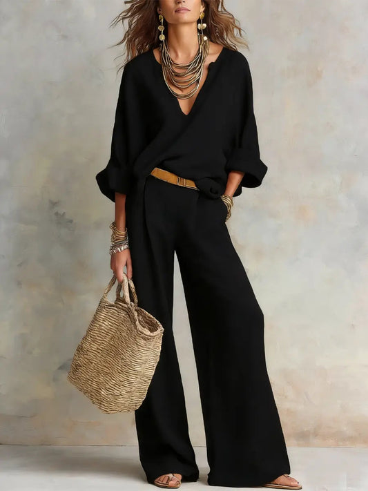 Black linen two-piece set with V-neck blouse and wide-leg trousers, tan belt