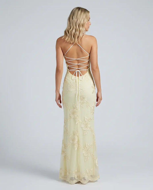 Cream fitted maxi dress back view with crisscross lace-up straps