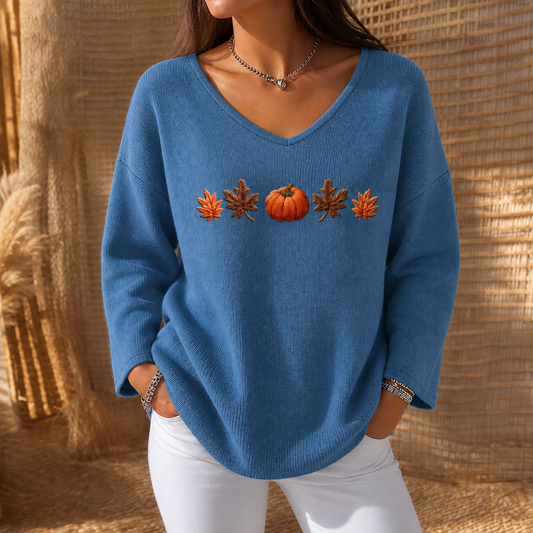 Blue V-neck long-sleeve knit shirt with orange pumpkin and leaf print across chest