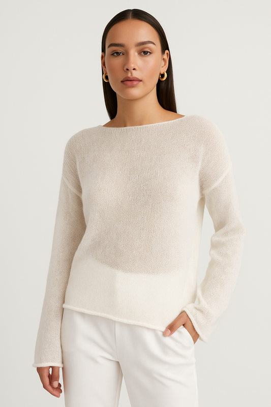 White sheer relaxed knit sweater with crew neck, long sleeves, and relaxed fit