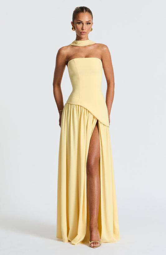 Butter yellow strapless maxi dress with side slit and draped asymmetrical panel
