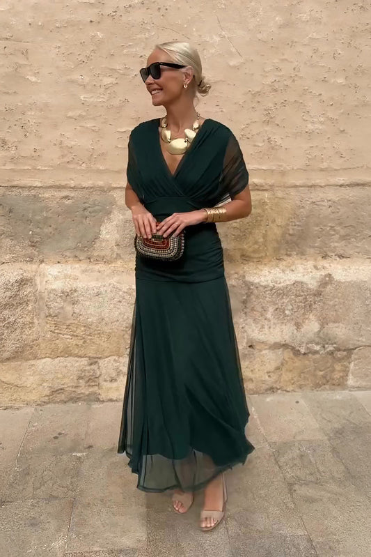 Green twist off-shoulder maxi dress with ruched bodice and flowing chiffon skirt