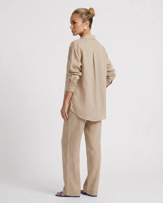 Beige two-piece button-up set with long-sleeve back button shirt and relaxed pants