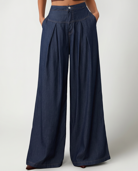 Navy denim wide-leg jeans with front pleats, button fly, and side pockets