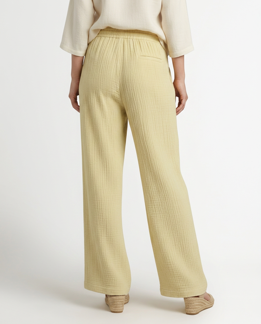 Light yellow wide-leg trousers with elastic waist and drawstring, straight relaxed legs