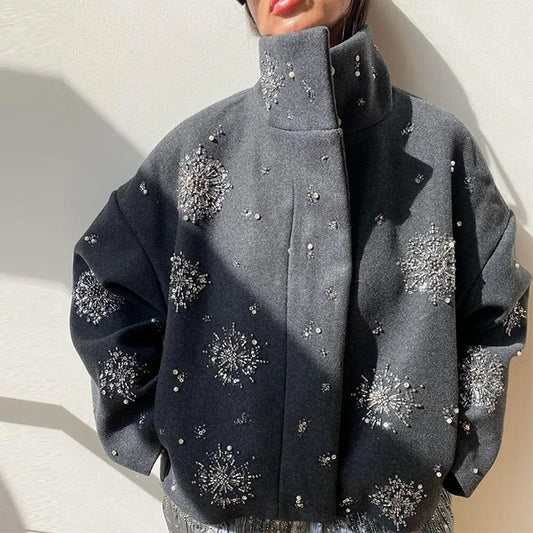 Gray wool cropped coat with high collar and shimmering silver beading across front