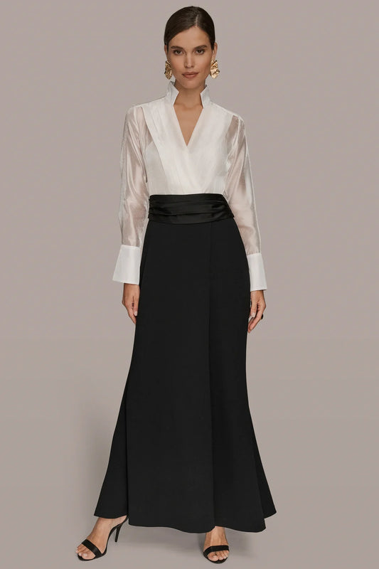 Wrap tuxedo gown: cream high-collar wrap top, black belted long skirt.