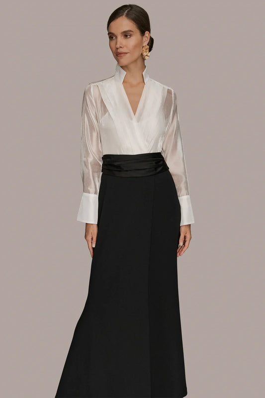 Tuxedo wrap gown front: cream V-neck wrap bodice with high collar and black long skirt.