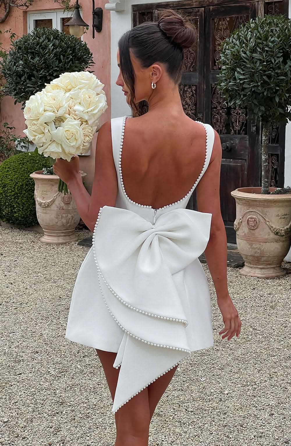 White A-line mini dress with bow back and pearl-trim scalloped straps