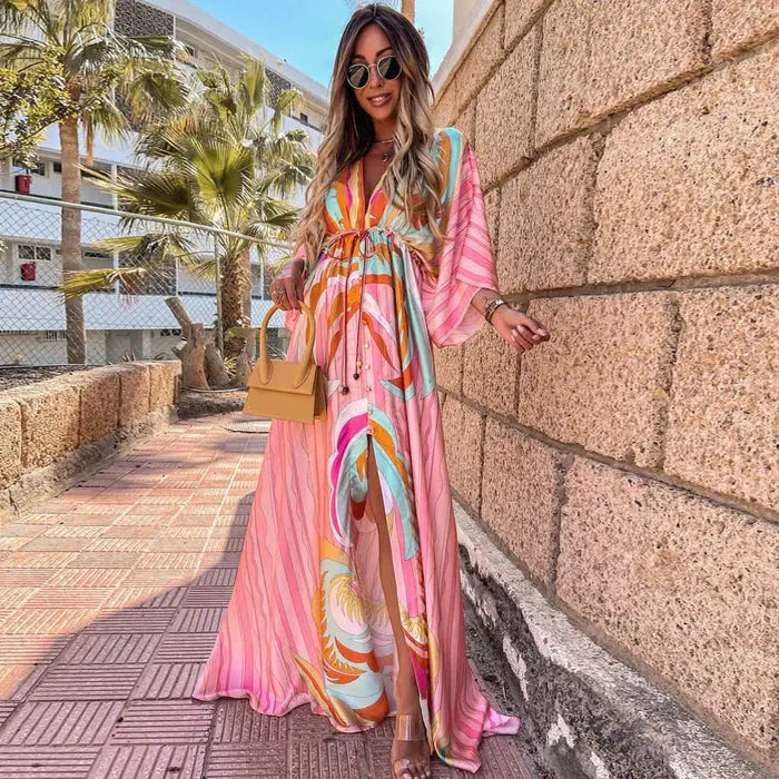 Light pink abstract print maxi dress with kimono sleeves and flowing tiered skirt