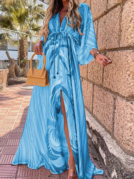 Blue abstract print maxi dress with kimono sleeves and gathered, flowing skirt
