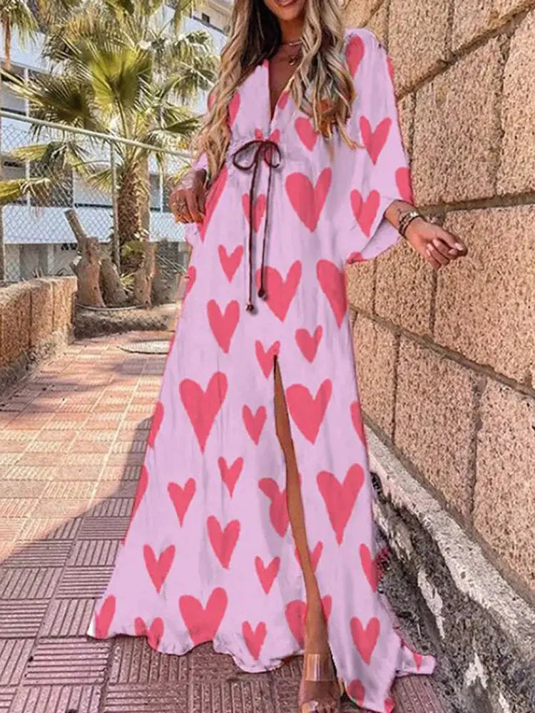 White maxi dress with pink heart print and kimono sleeves, full-length skirt