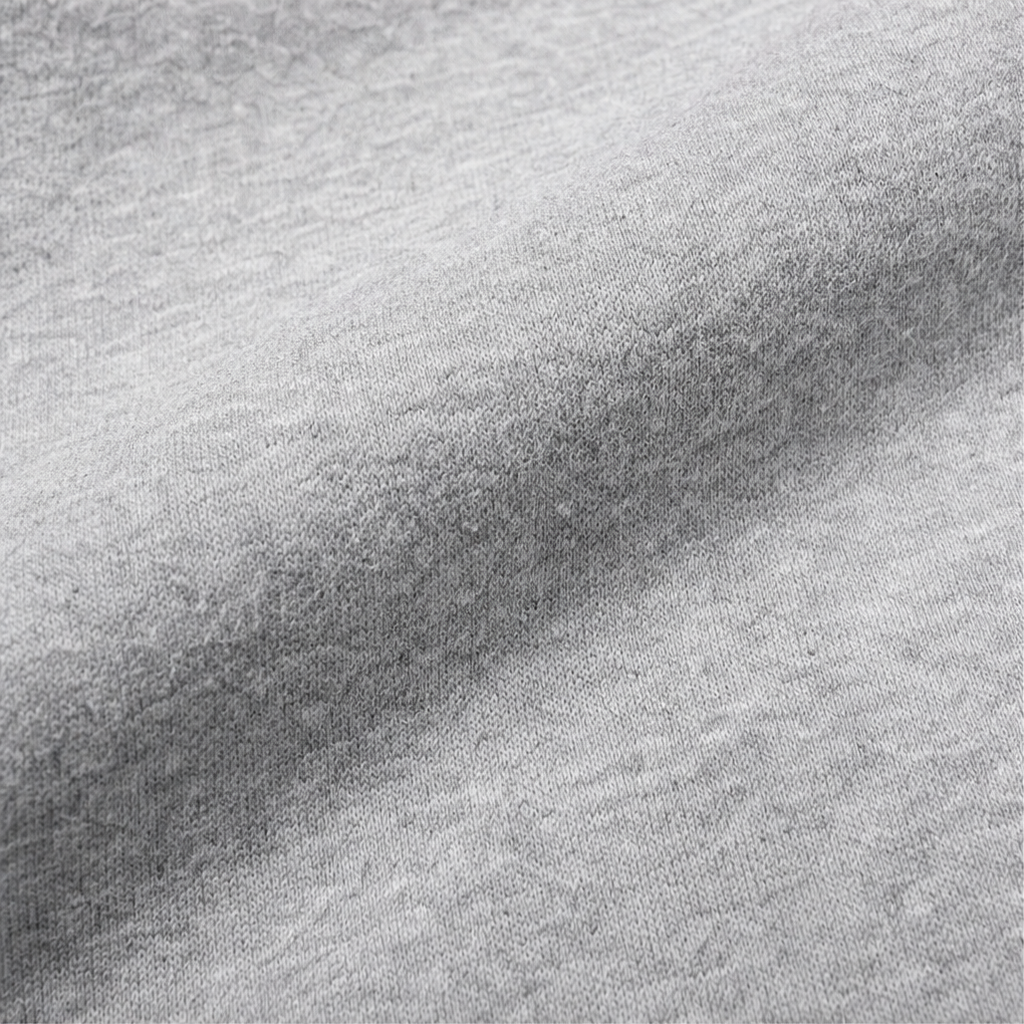 Close-up of heather gray knit fabric texture from the hooded jacket