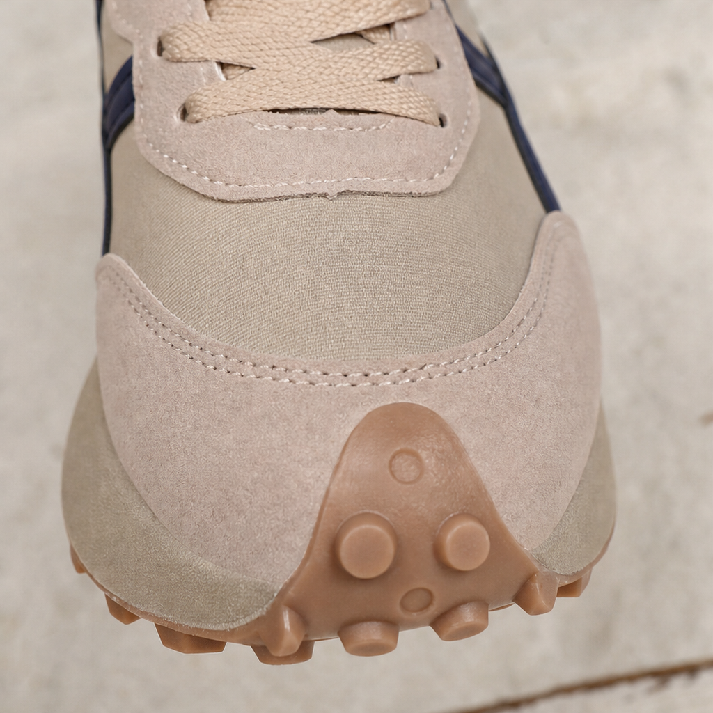 Close-up of sneaker heel with textured anti-slip tread pods.