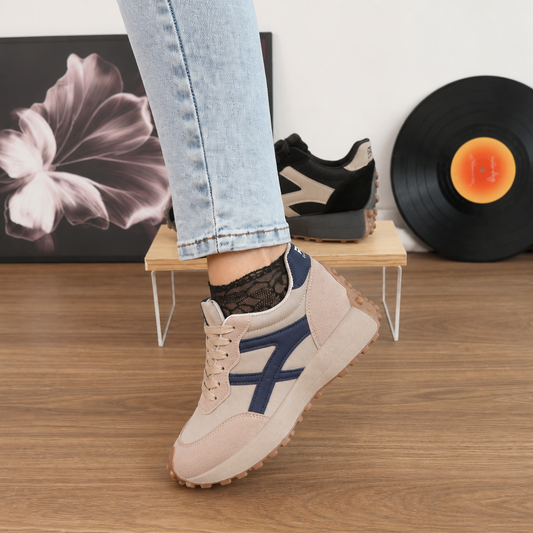 Beige platform sneakers with navy panels and tan sole, lace-up with textured grip