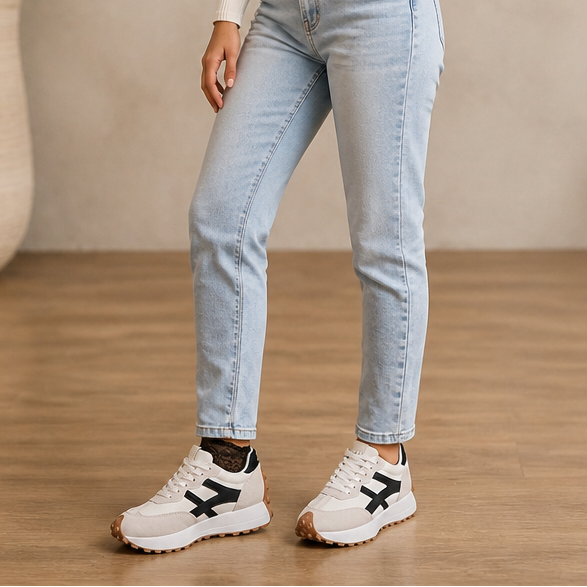 White platform sneakers with dark accents, lace-up design and textured grip sole