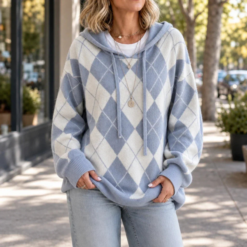 Blue and cream argyle hooded knit sweater with drawstrings and ribbed cuffs and hem.