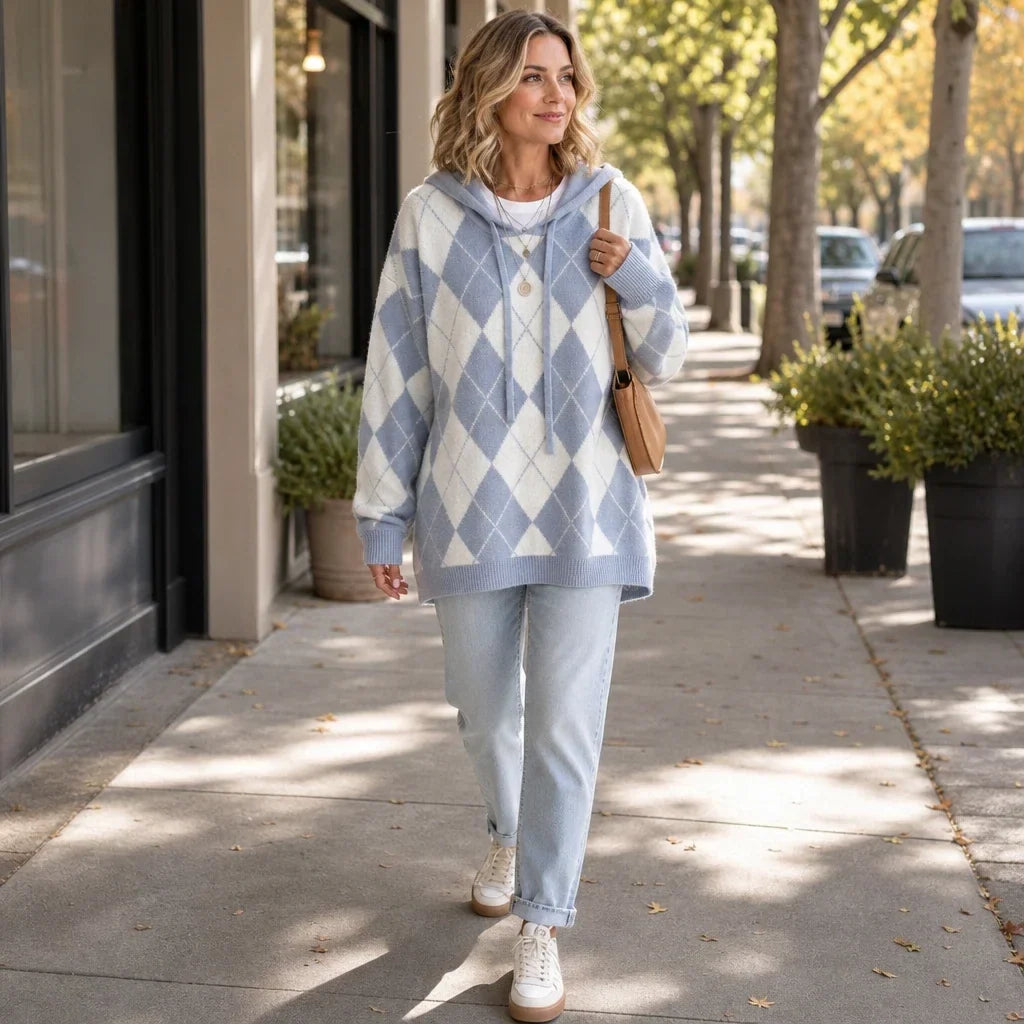 Longline blue and cream argyle hooded knit sweater with drop shoulders and ribbed trim.