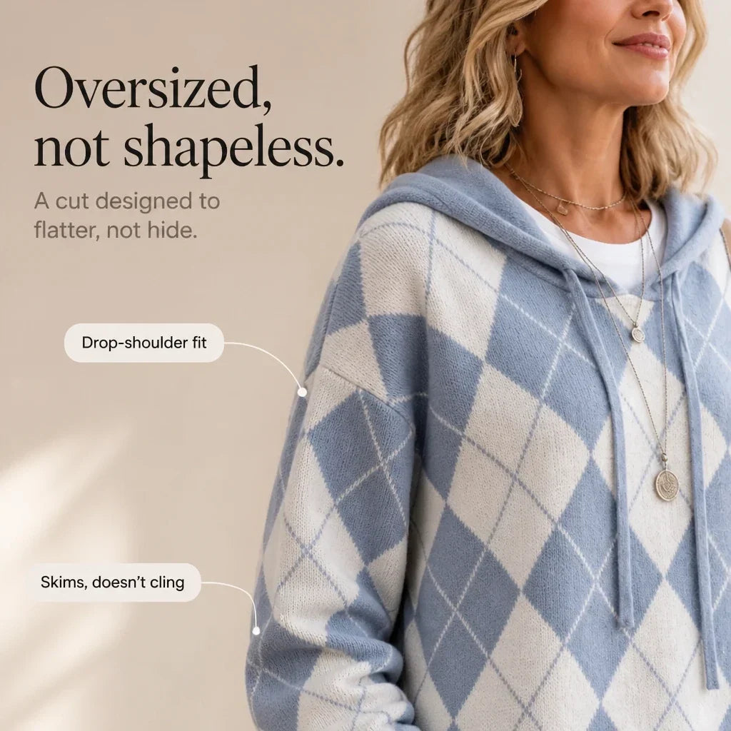 Close view of the sweater's blue and cream argyle pattern and relaxed drop-shoulder fit.