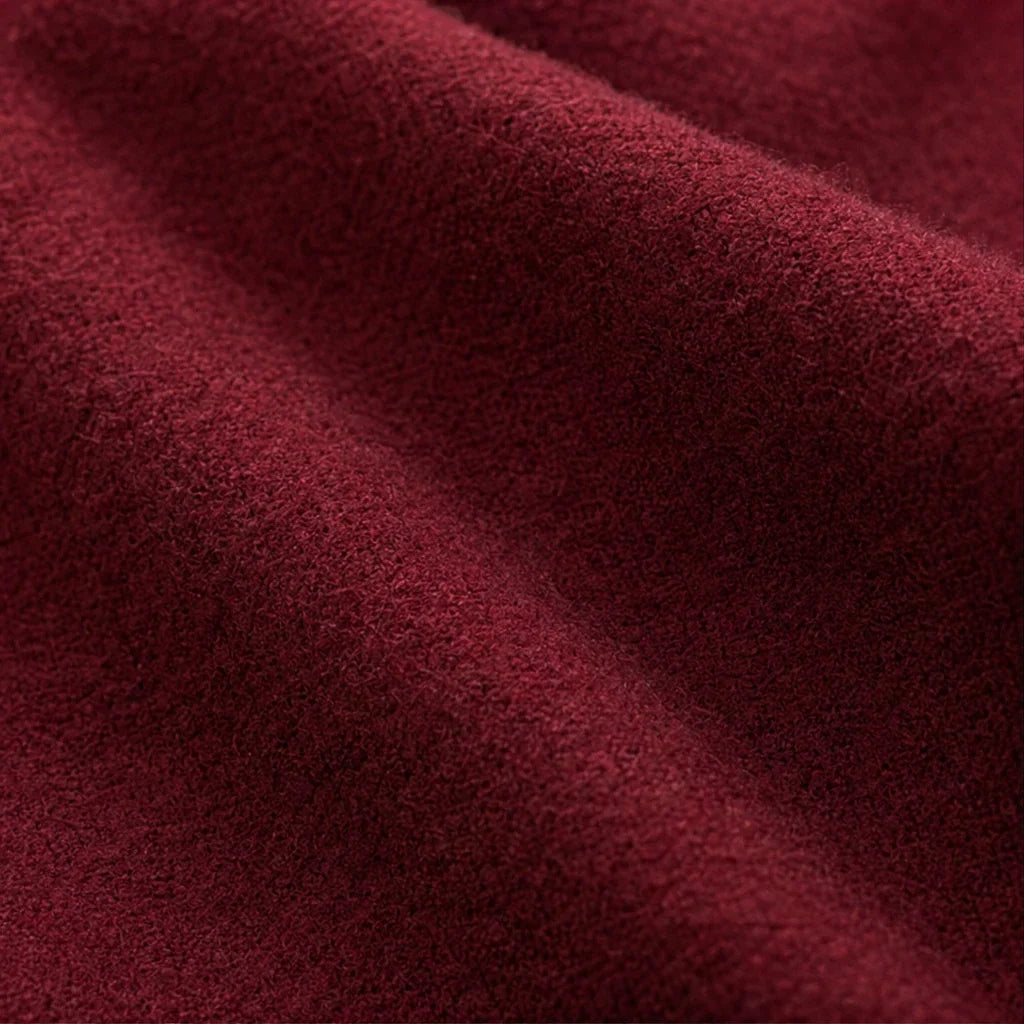 Close-up of the burgundy knit fabric's soft, fuzzy texture