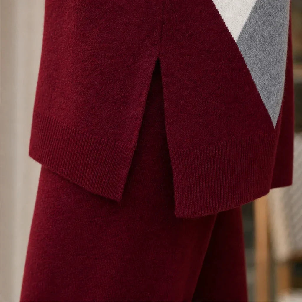 Close-up of the sweater's ribbed hem and side slit above matching trousers