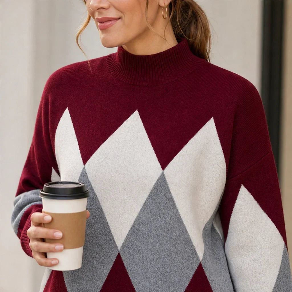 Burgundy argyle knit sweater with a high ribbed neck and large diamond pattern