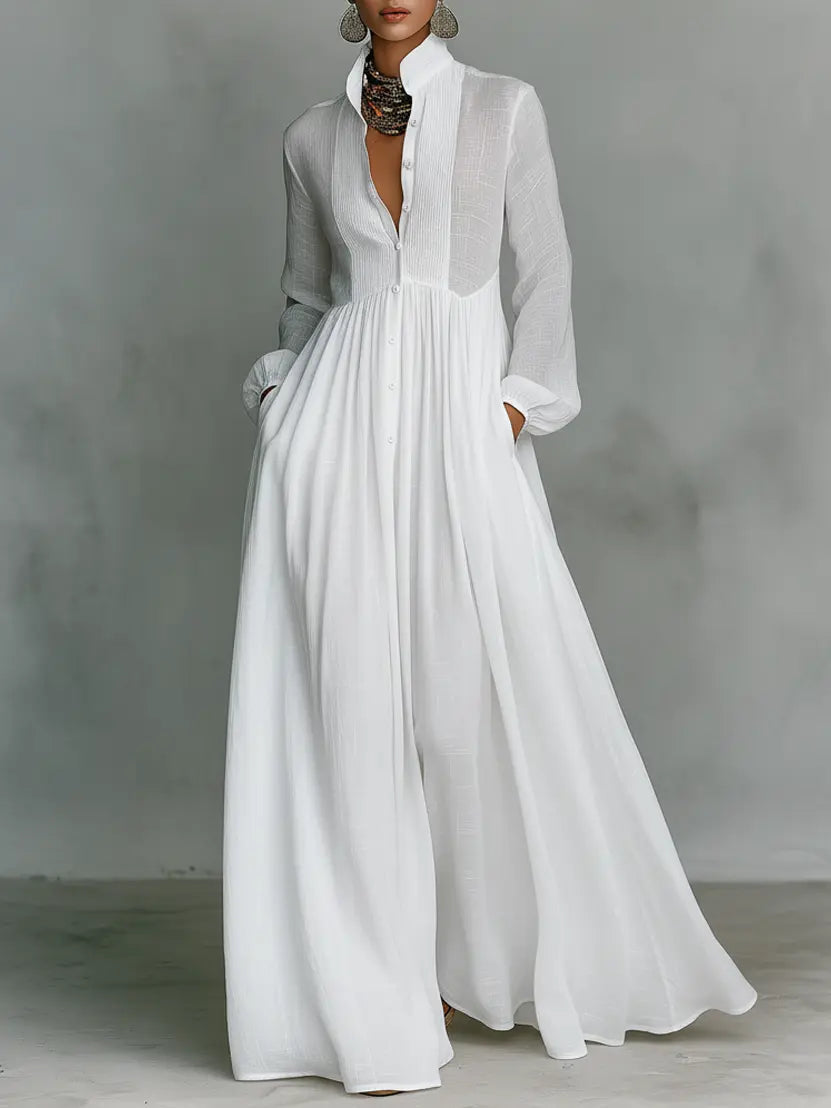 White maxi dress with long sleeves, v-neck, and gathered waist