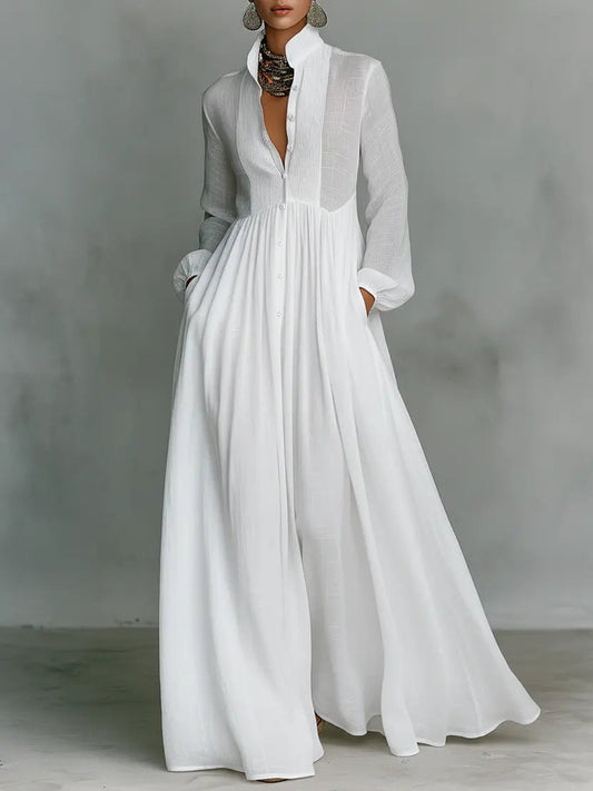 White maxi dress with long sleeves, v-neck, and gathered waist