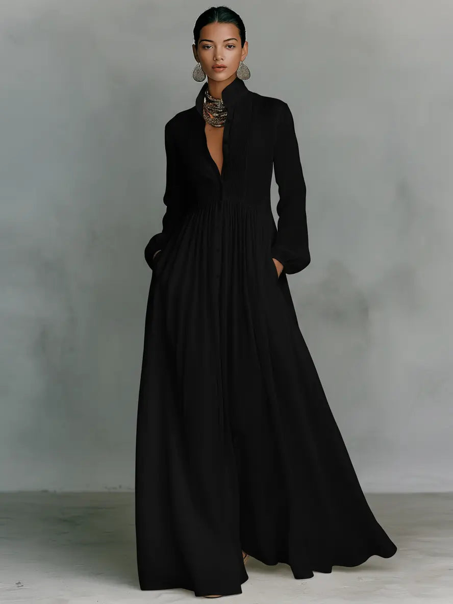 Black maxi dress with long sleeves, v-neck, and gathered waist