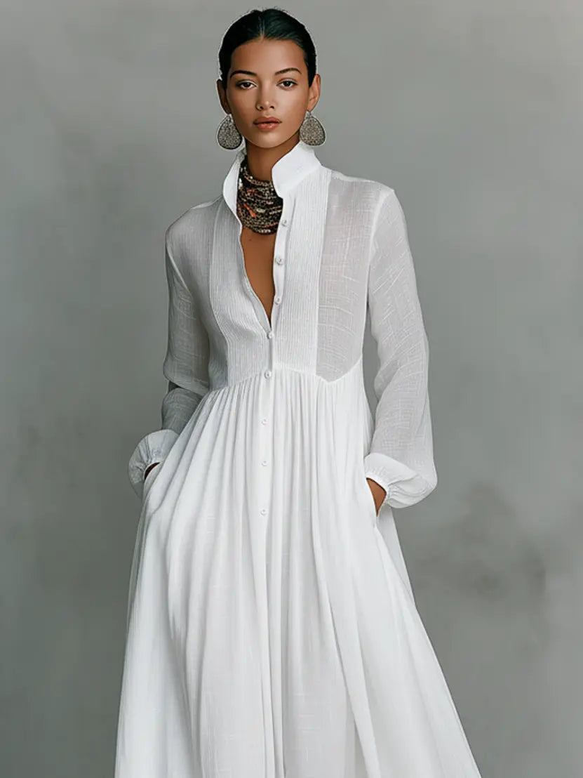 White maxi dress with long sleeves and button-front v-neck