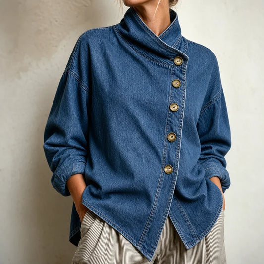 Blue denim-look jacket with an asymmetric button front, stand collar, and long sleeves