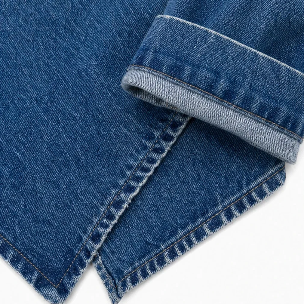 Close-up of the jacket's cuff, exposed reverse weave, and stitched hem