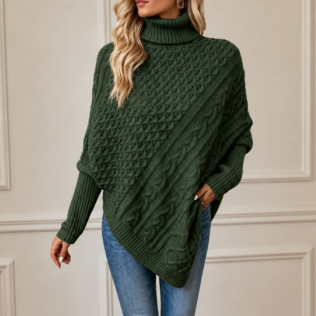 Dark green asymmetric cable-knit turtleneck poncho with long sleeves and diagonal knit drape
