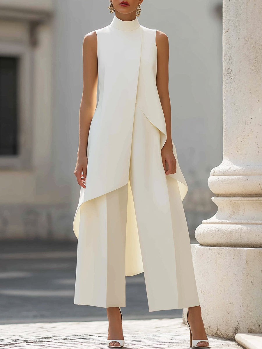 White asymmetric sleeveless top with layered drape and wide-leg pants set