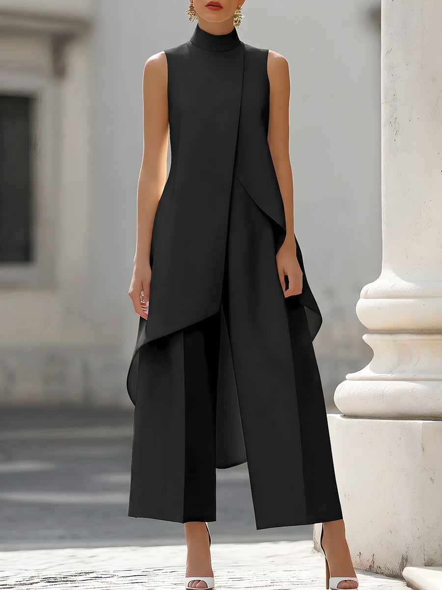 Black sleeveless asymmetric top with layered drape and wide-leg pants set
