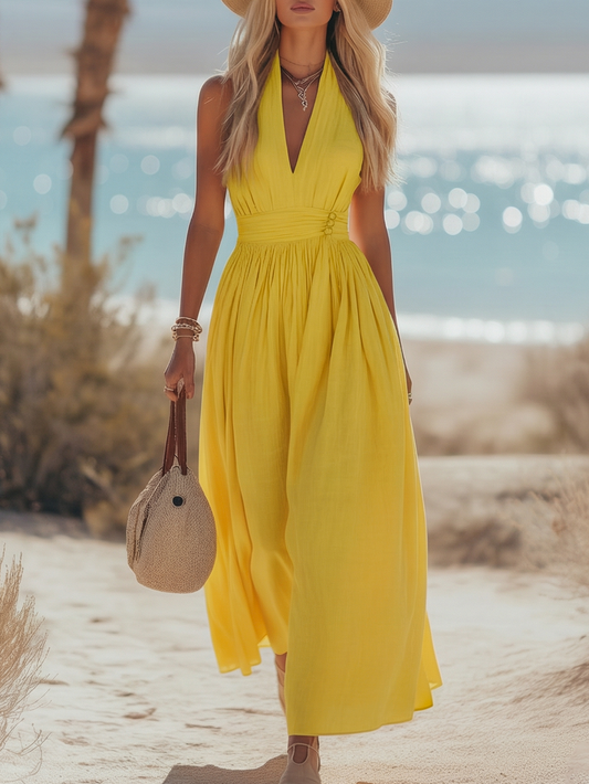 Yellow halter V-neck linen dress with ruched waist and flowing pleated skirt