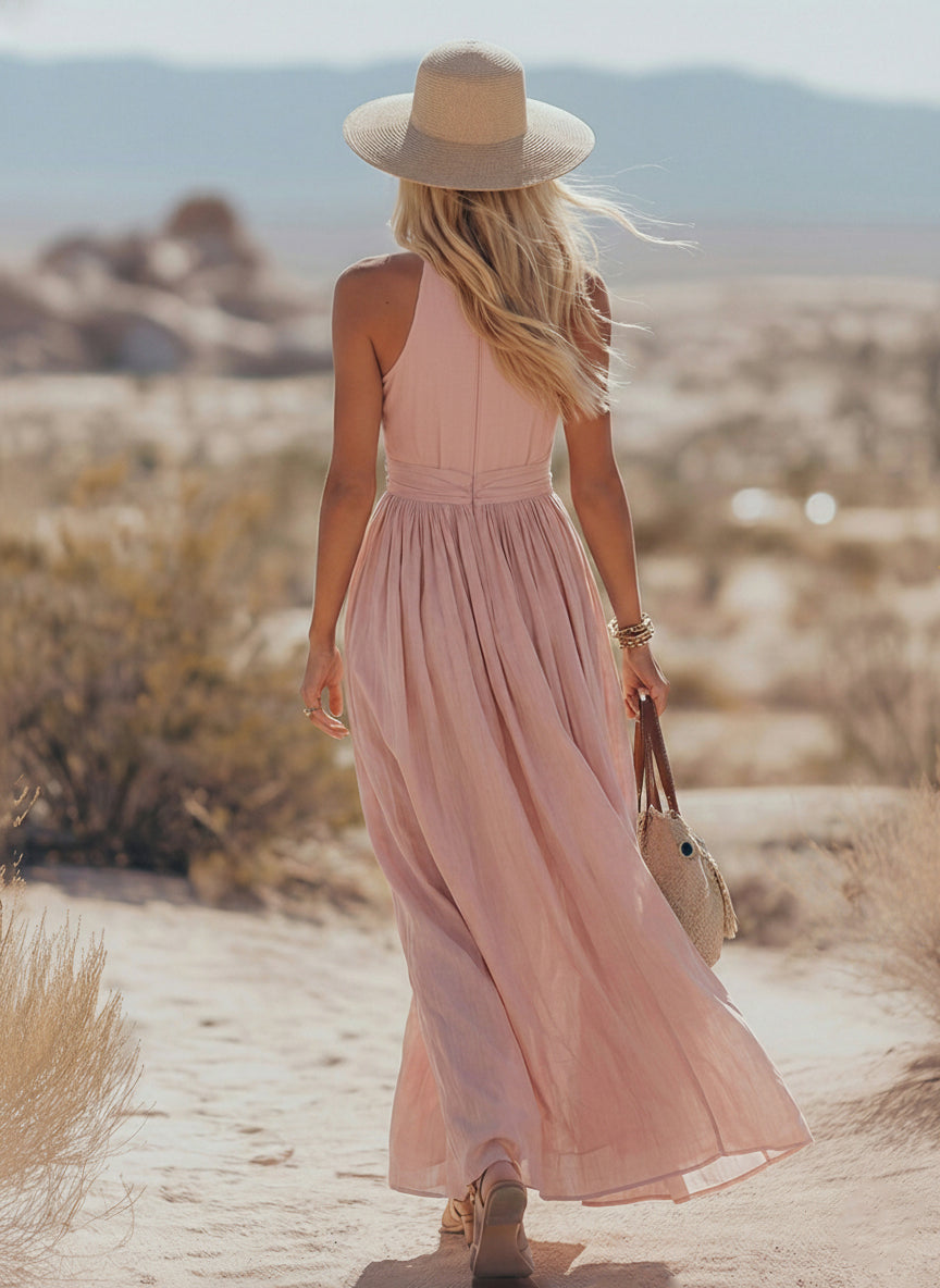 Pink halter V-neck linen dress with gathered bodice and flowing tiered skirt