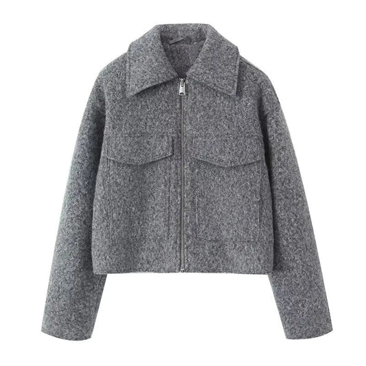 Grey cropped jacket with pointed collar, zip front, and flap chest pockets