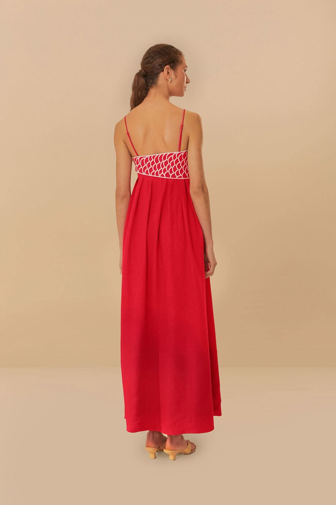 Red maxi dress with spaghetti straps and white lattice back detail