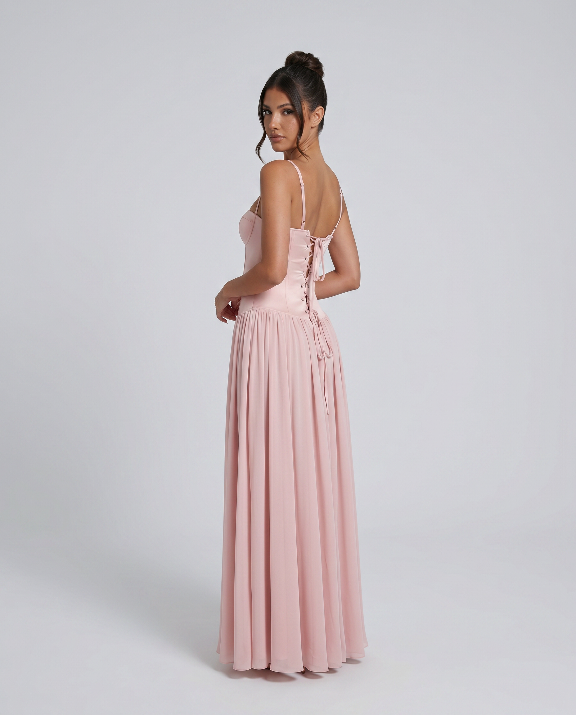 Pink corset maxi dress with spaghetti straps and gathered pleated skirt