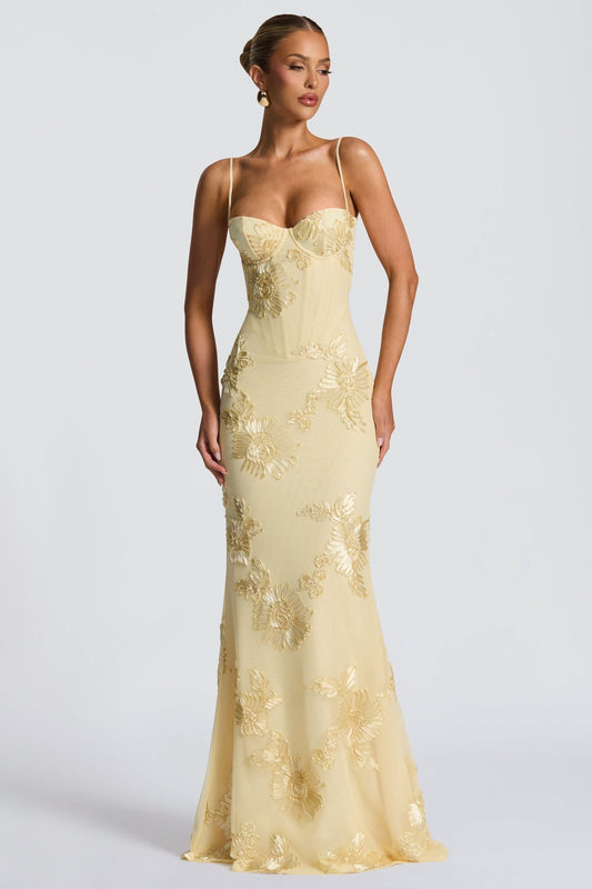 Yellow bustier maxi dress with floral applique, thin spaghetti straps, sweetheart neckline