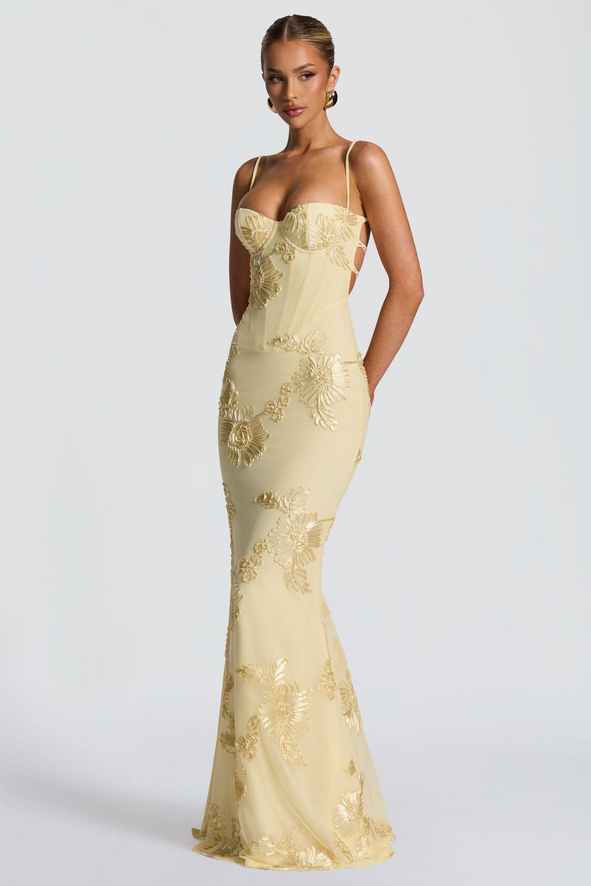 Yellow bustier maxi dress with floral applique, lace-up corset bodice